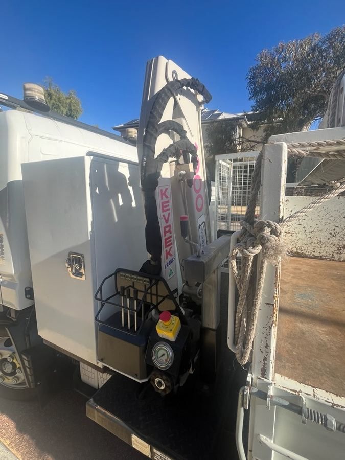 Kevrek crane mounted behind the cab, with controls and stabiliser